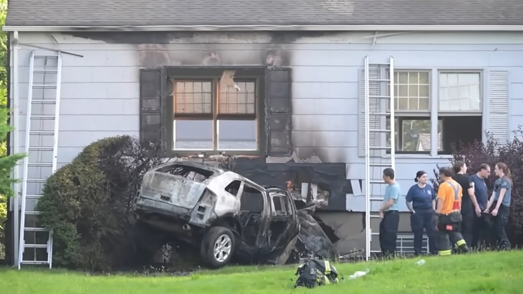 Burned car crashed into a house.