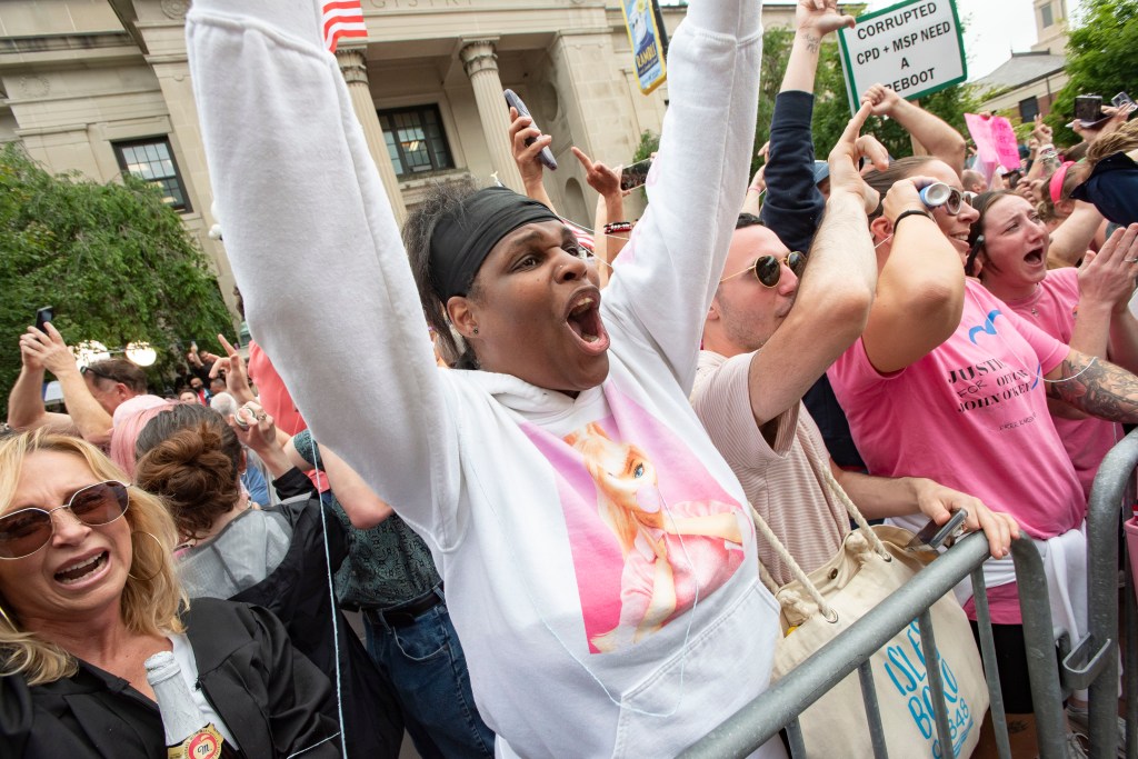 A supporter of Read celebrating the not guilty verdict.