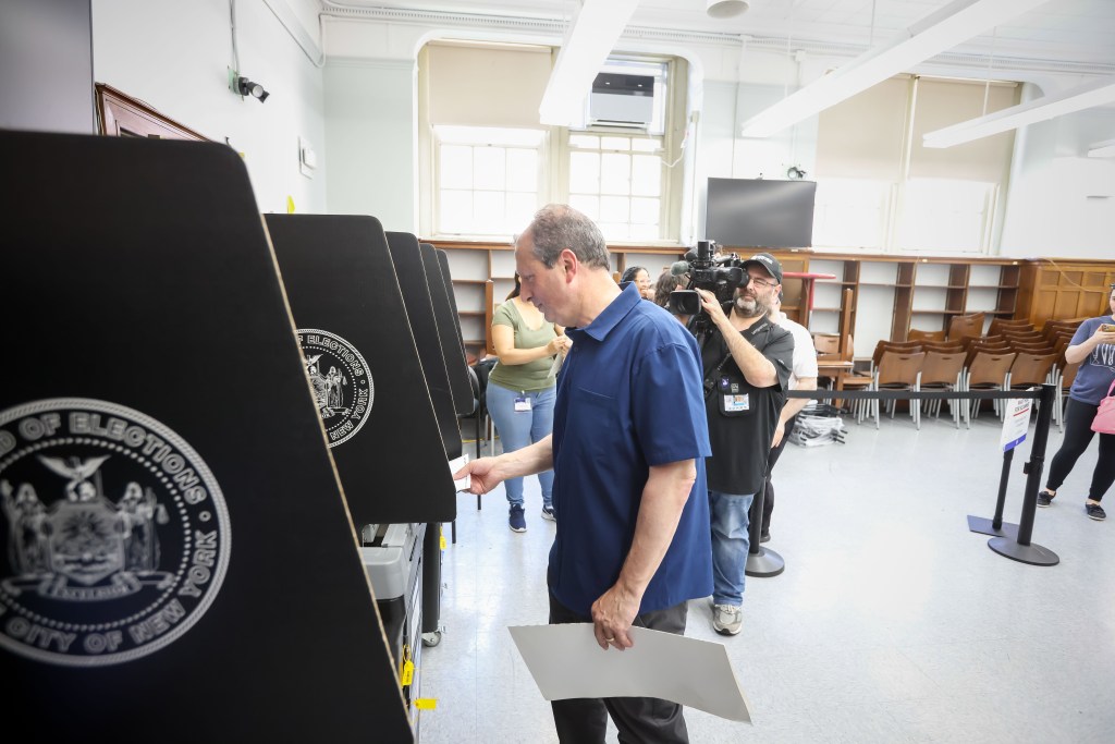 NYC mayoral candidate Brad Lander casting his ballot.