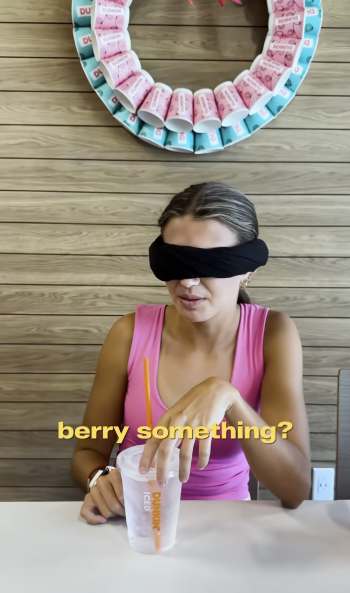 Kai Trump tastes drinks while blindfolded. 