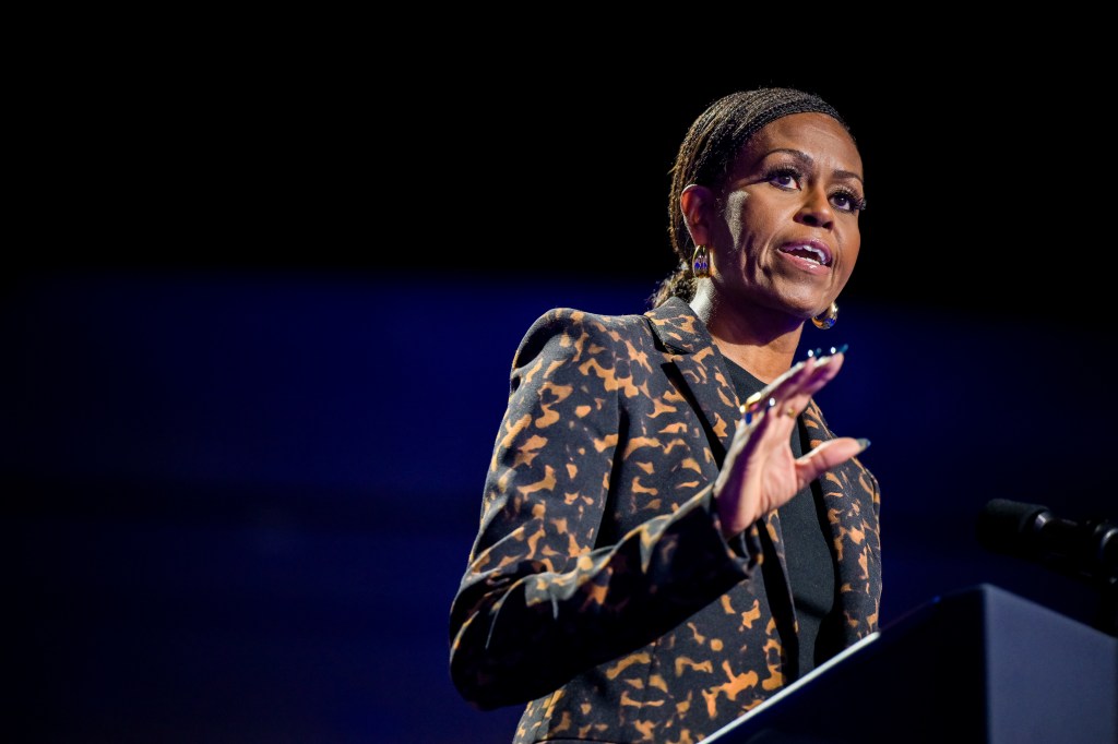 Michelle Obama speaking at a campaign rally.