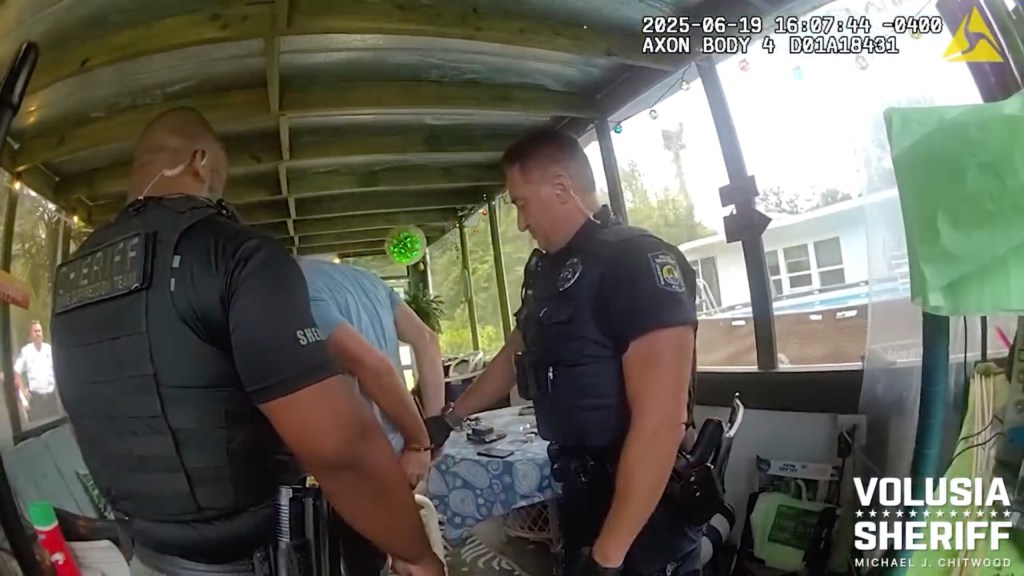 Bodycam footage from the sheriff's office captured the moment the deadbeat dad was detained inside an enclosed porch on the property.