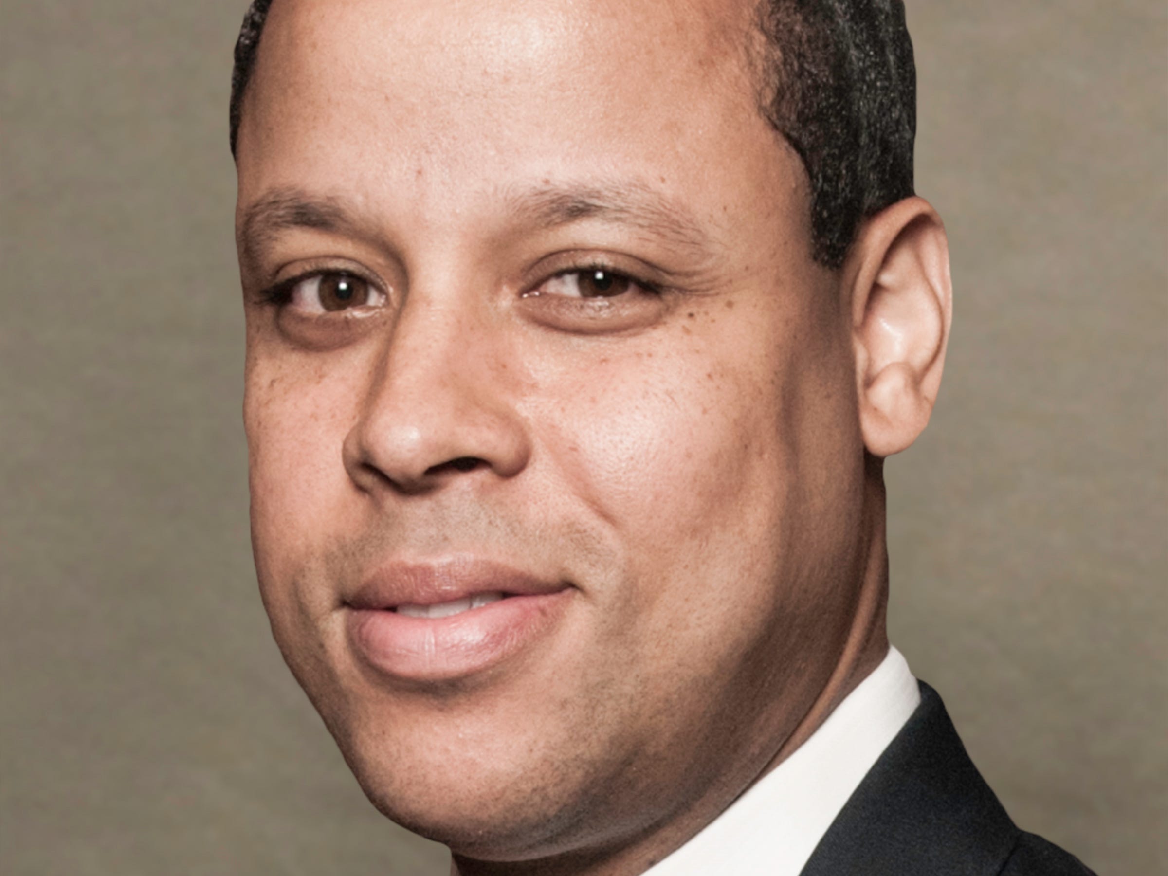 Verdun Perry, Global Head of Blackstone Strategic Partners in a suit.