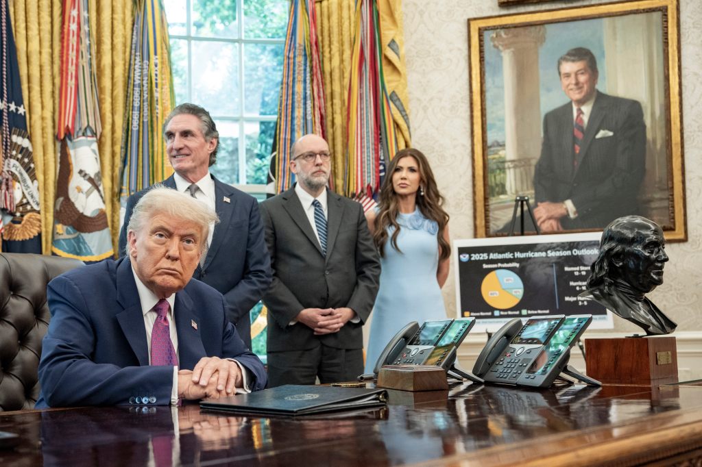 President Donald Trump sits in the Oval Office of the White House alongside members of his cabinet on June 10, 2025.