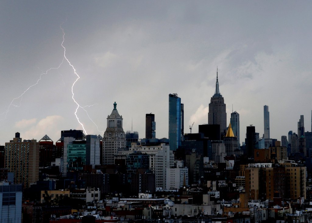 Lightning striking near the Empire State Building during a thunderstorm in Manhattan.