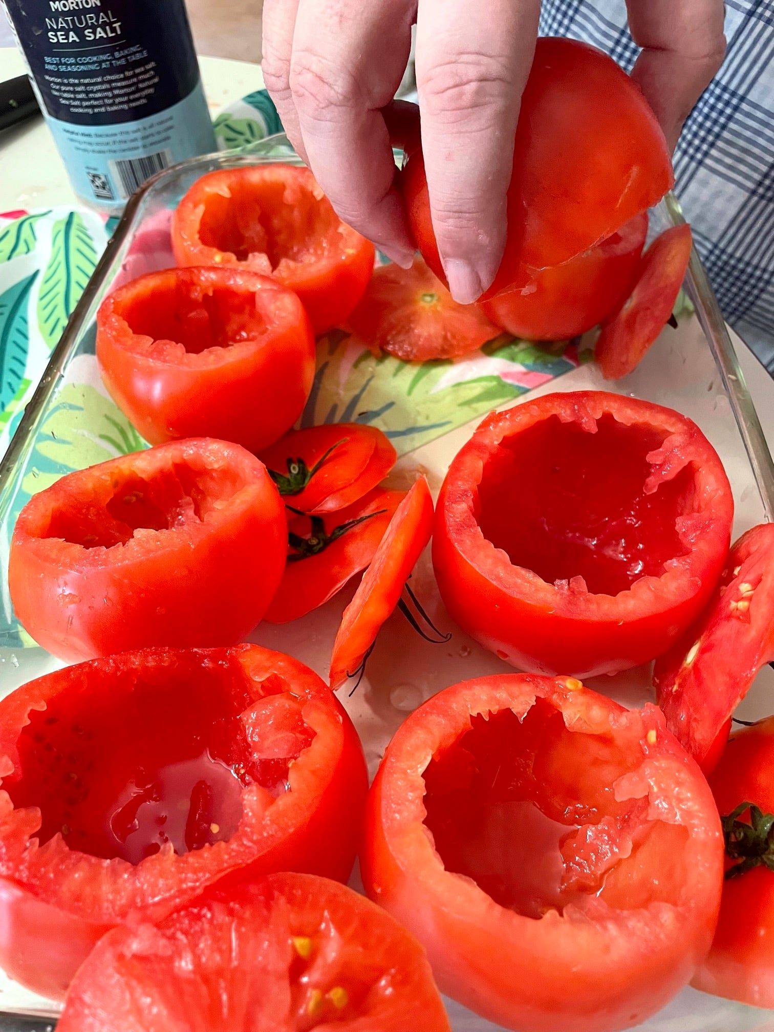 Pouring out water in tomatoes for yemista