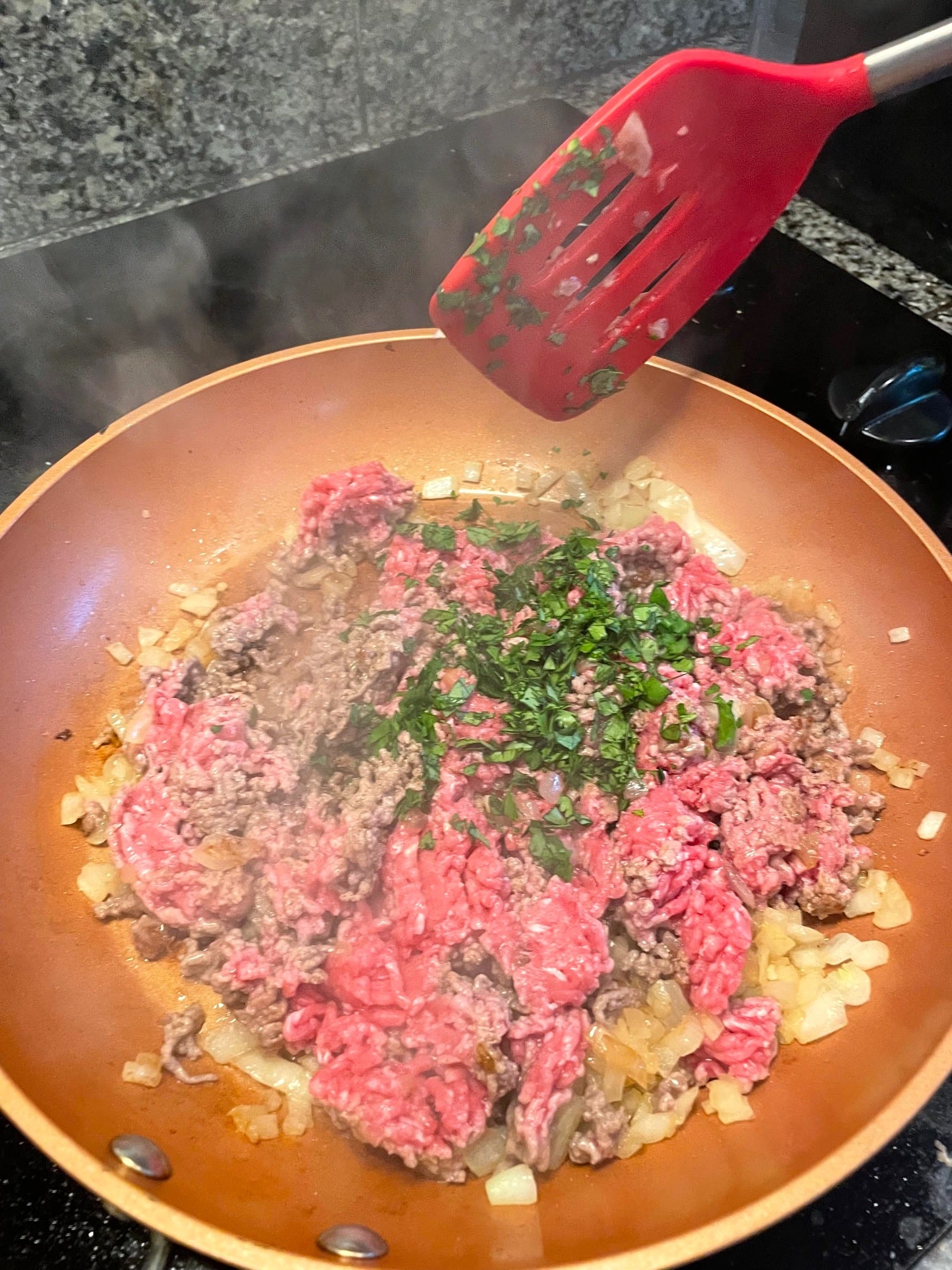 Adding parsley for yemista