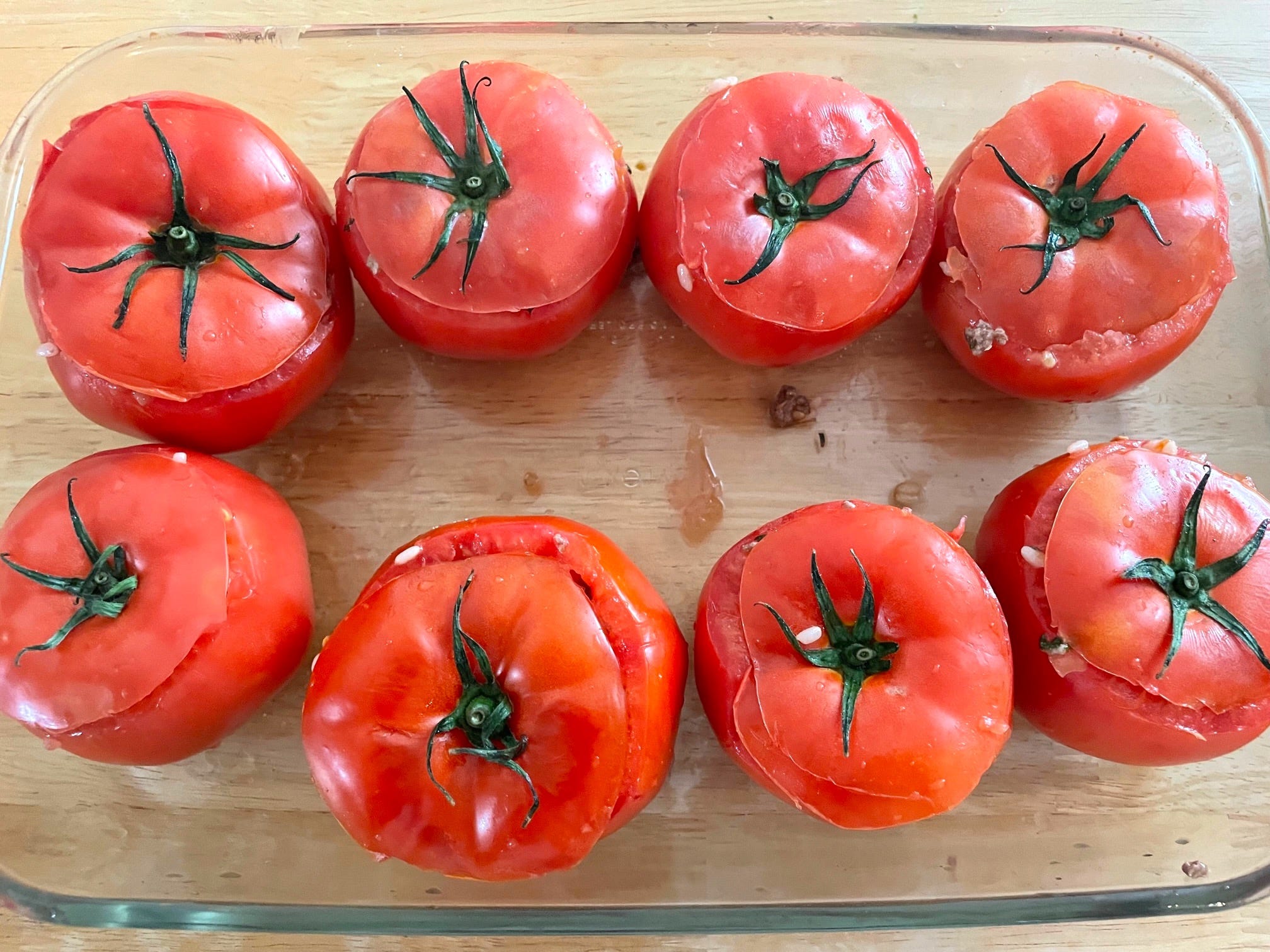 Tomatoes with tops on before going in the oven for Yemista