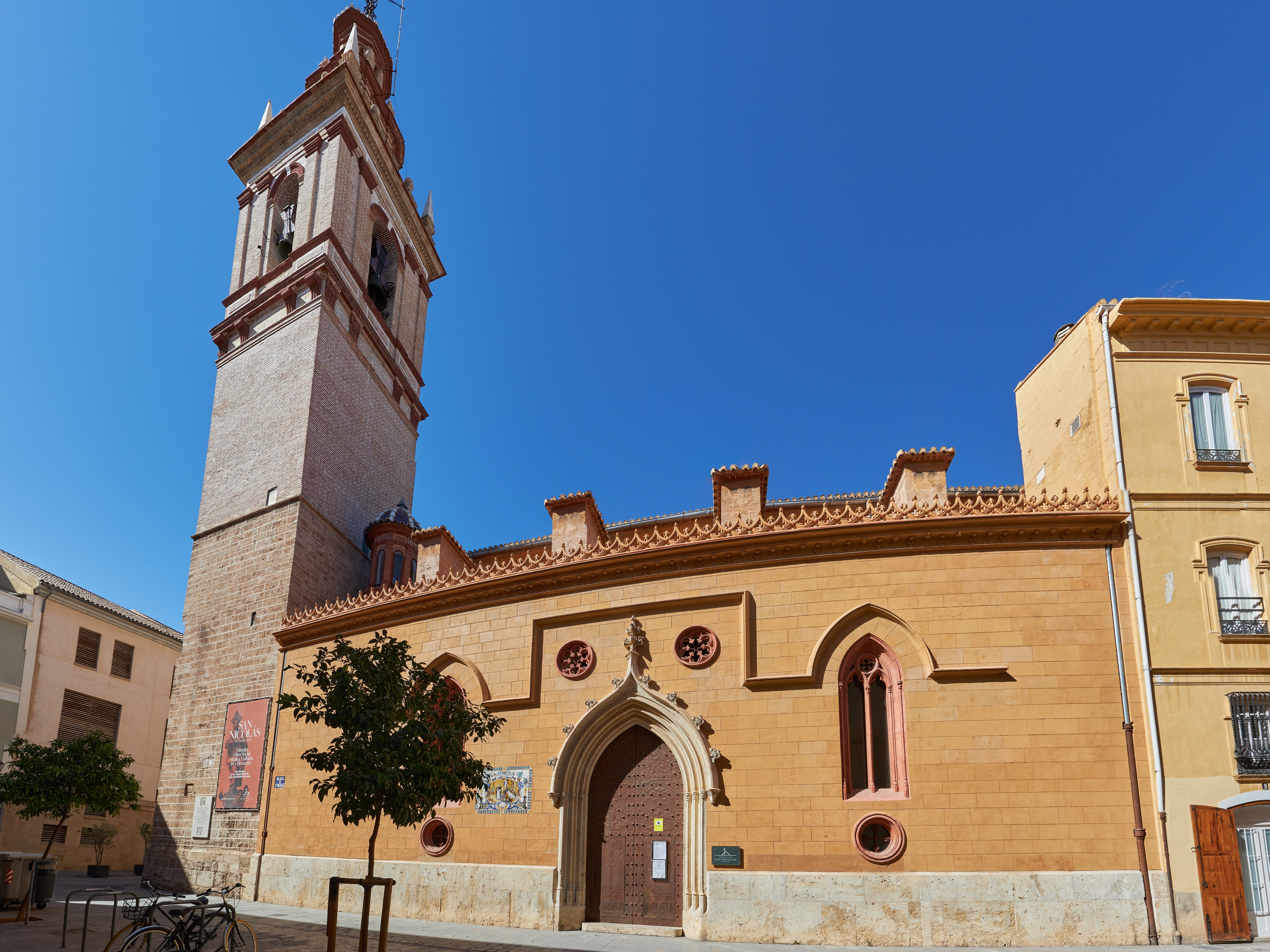 The exterior of the Church of San Nicolás in Valencia, Spain, on a clear day.
