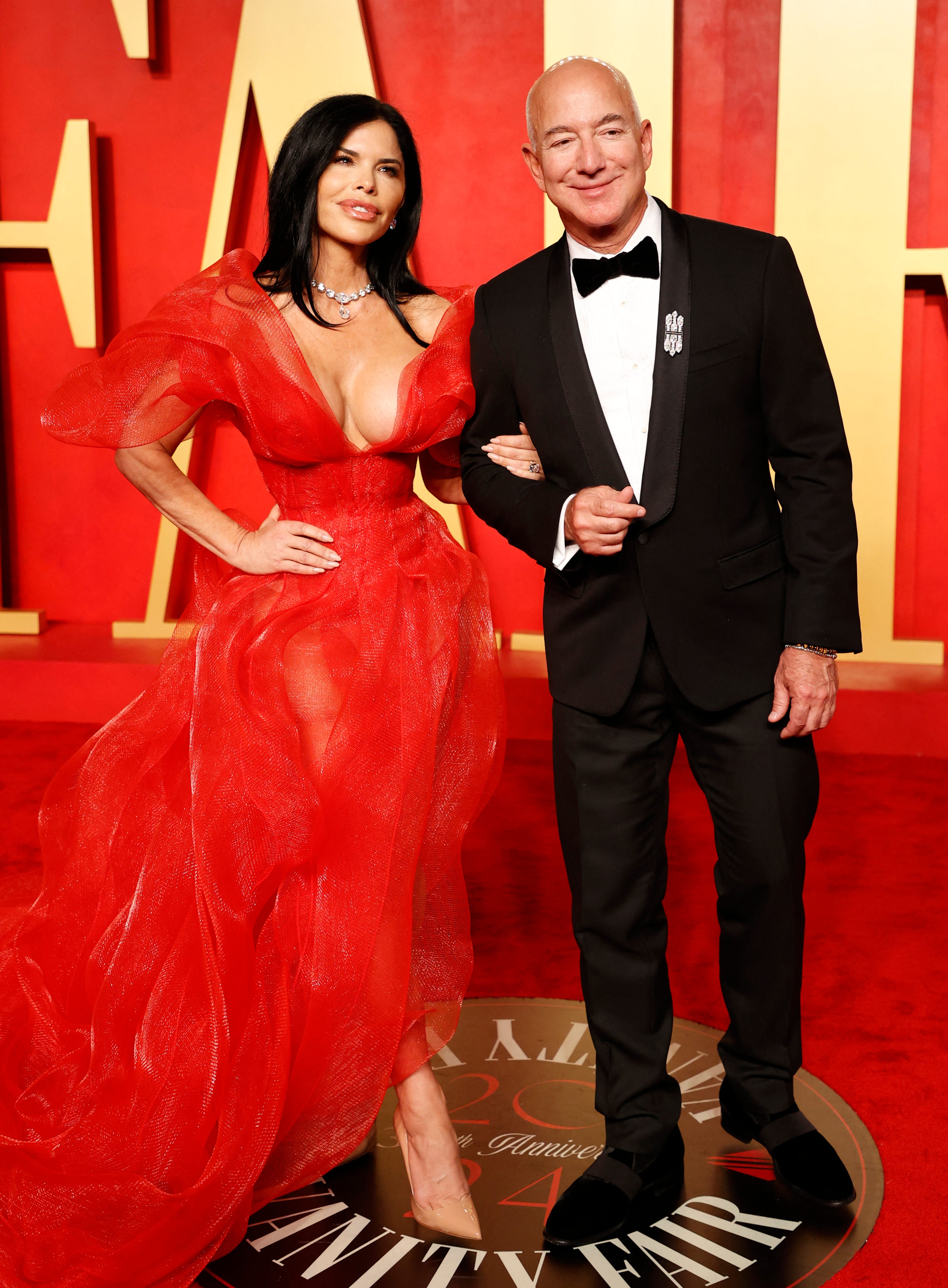 Lauren Sánchez and Jeff Bezos posed on the red carpet at the Vanity Fair Oscars Party in 2024.