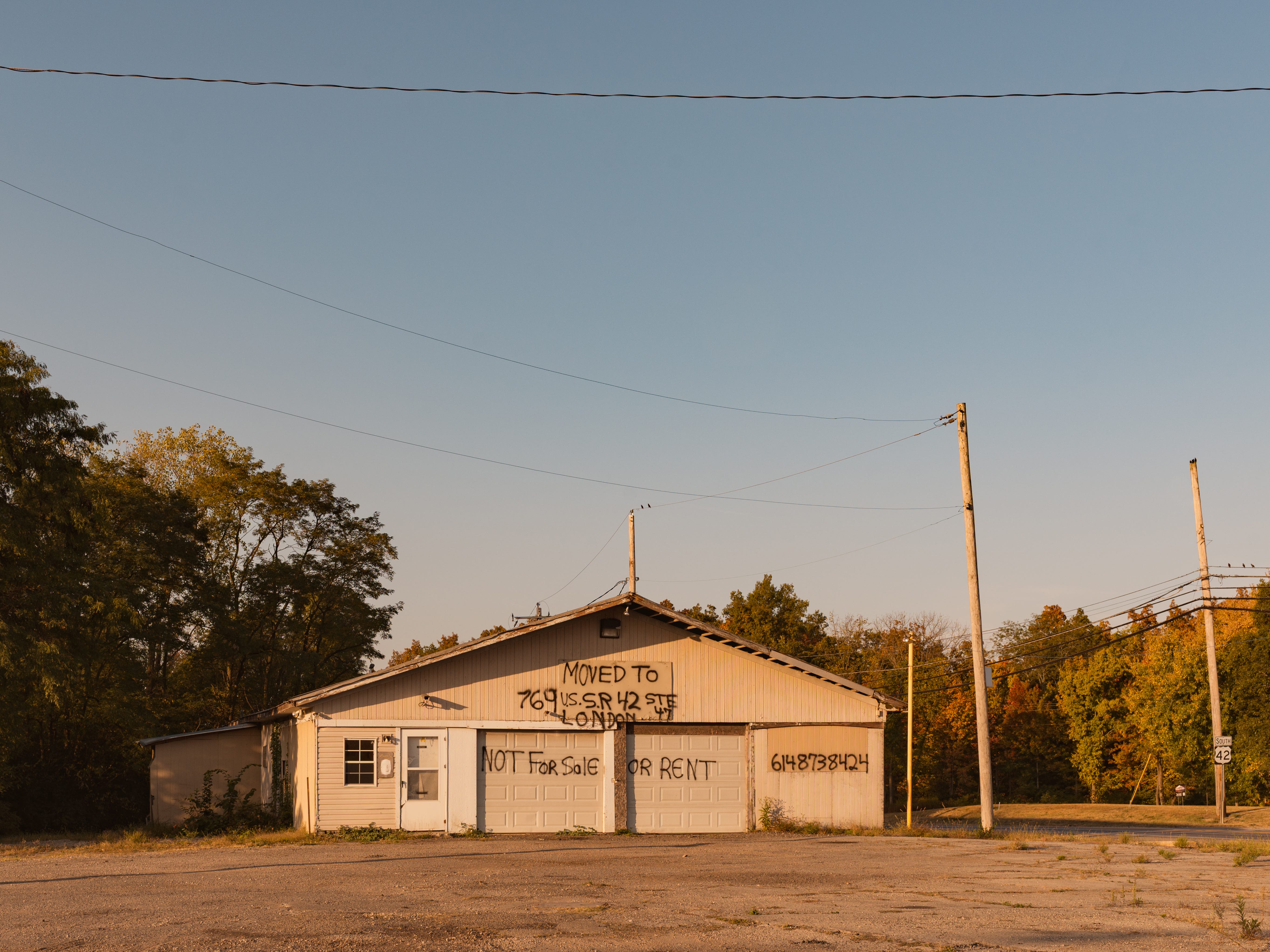 A shed with a makeshift spray painted sign outside of the New Albany Buisness Park, New Albany, OH