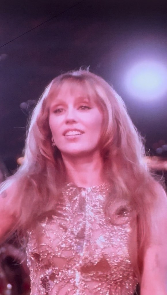 Miley Cyrus in gold look during Beyoncé show in Paris