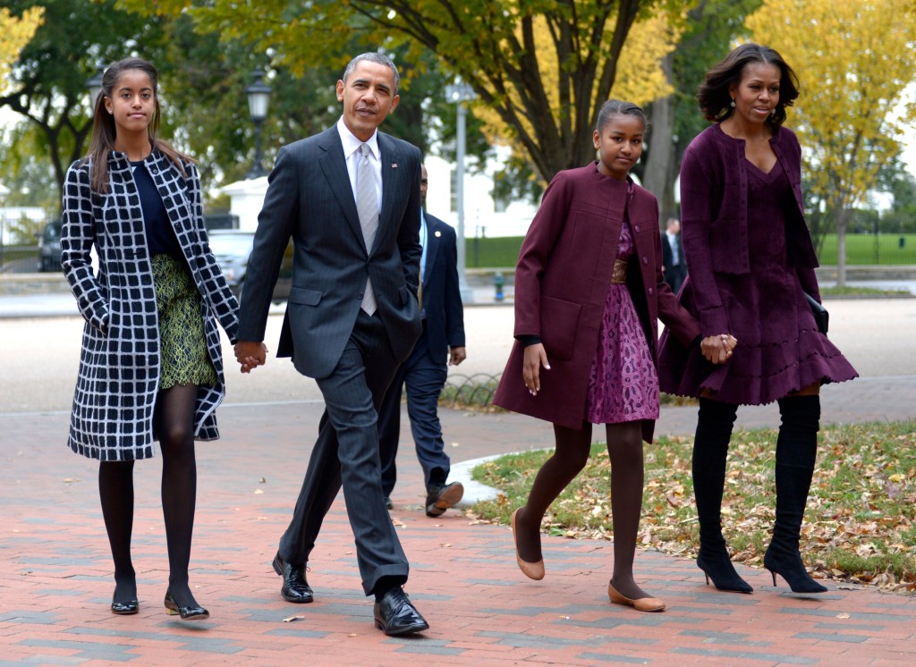 The Obama family walking.