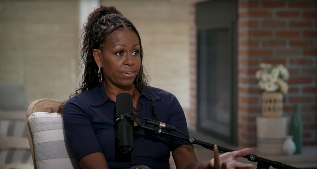 Michelle Obama talking on a podcast.