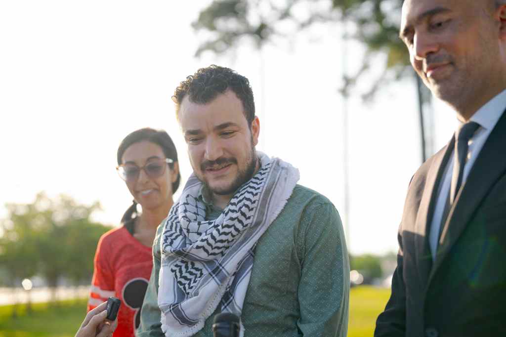Palestinian activist Mahmoud Khalil speaks to reporters.