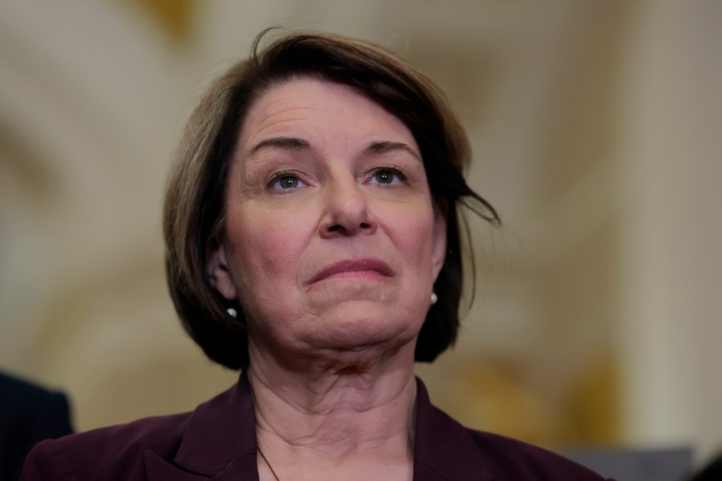 Close-up of Senator Amy Klobuchar at a press conference.
