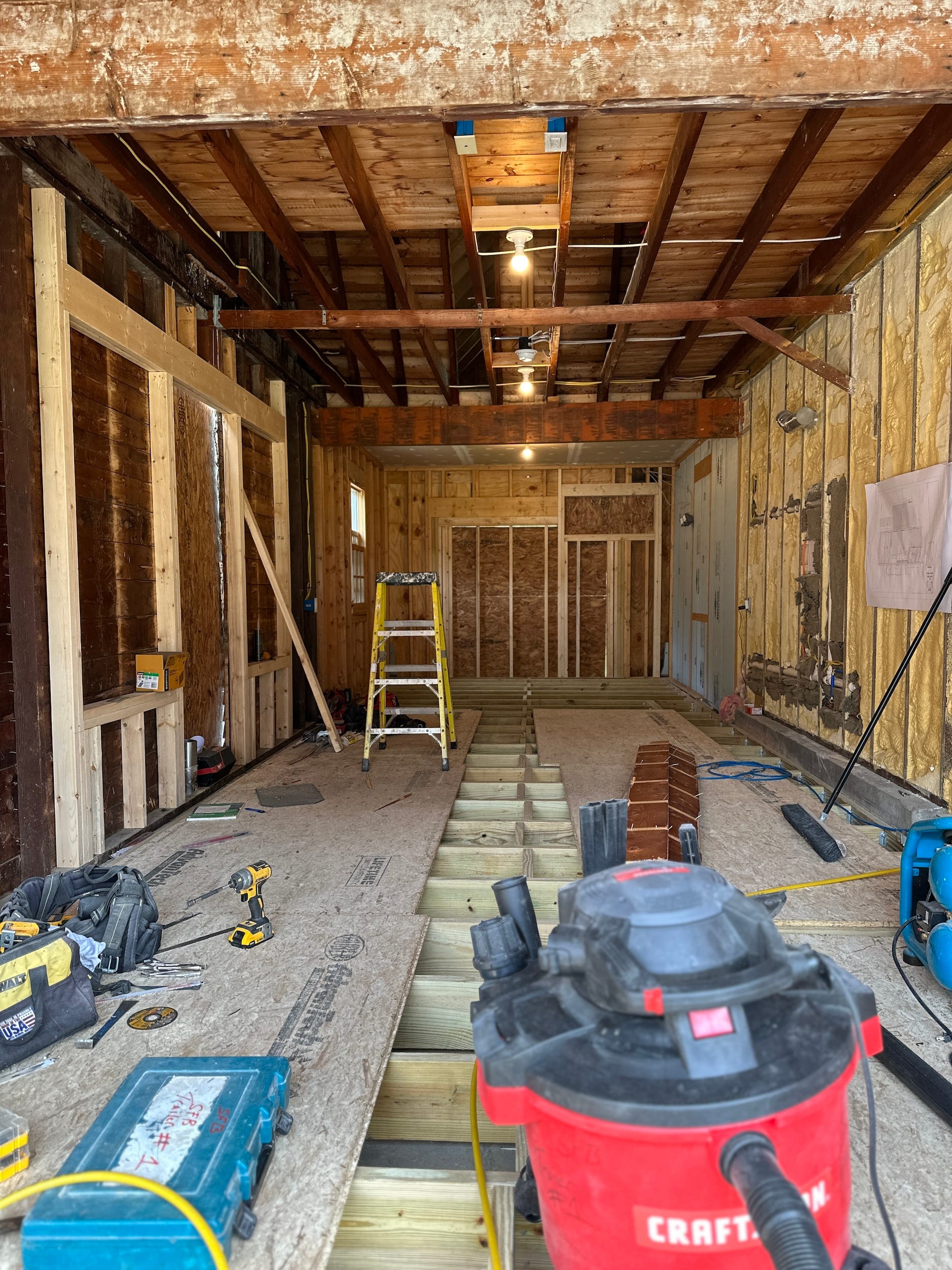 An unfinished renovation project in a garage.