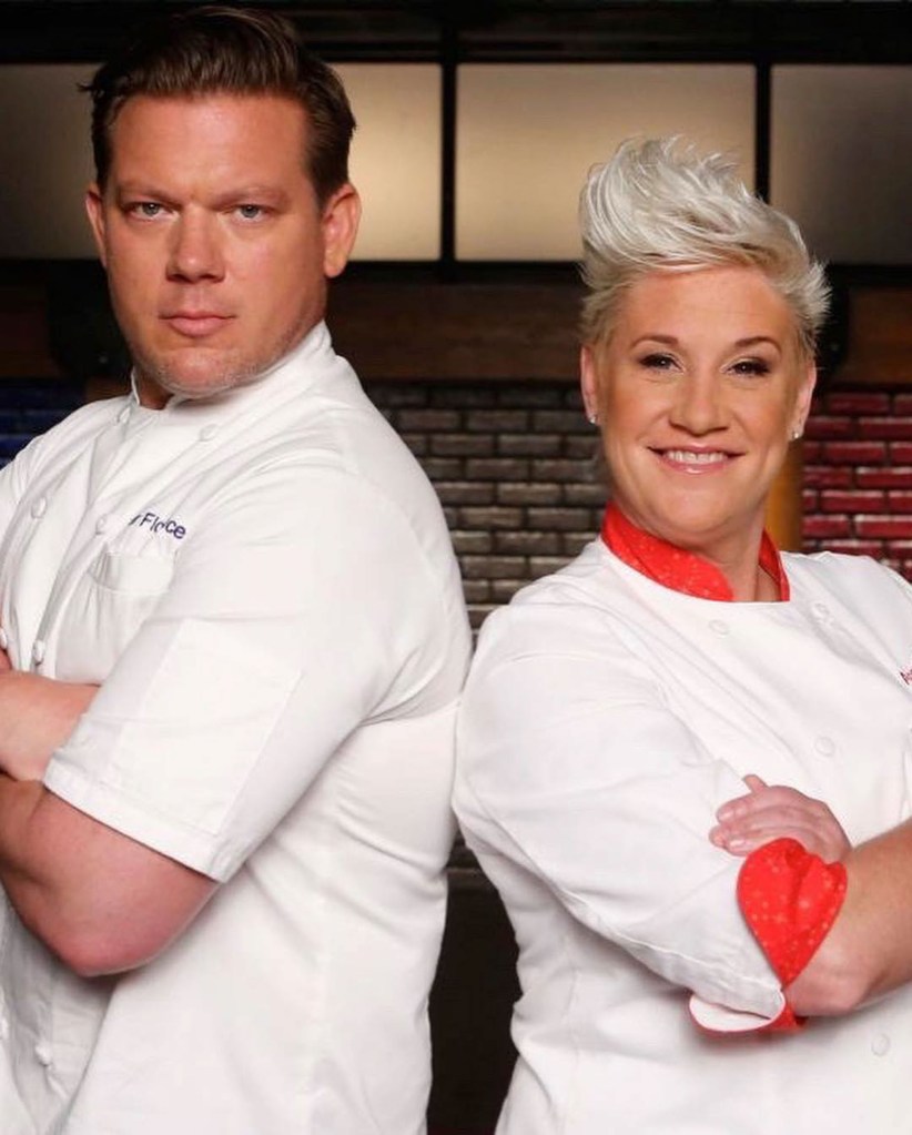 Anne Burrell in a chefs jacket with Tyler Florence.