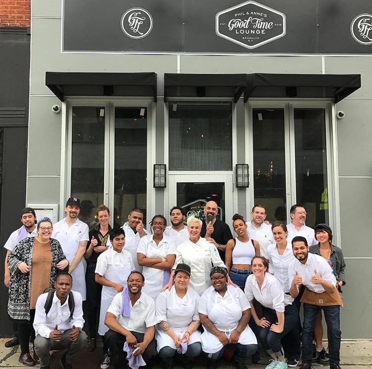 Anne Burrell and ex business parnter Phil Casaceli pictured outside her now closed restaurant Phil & Anne's with their former staff.