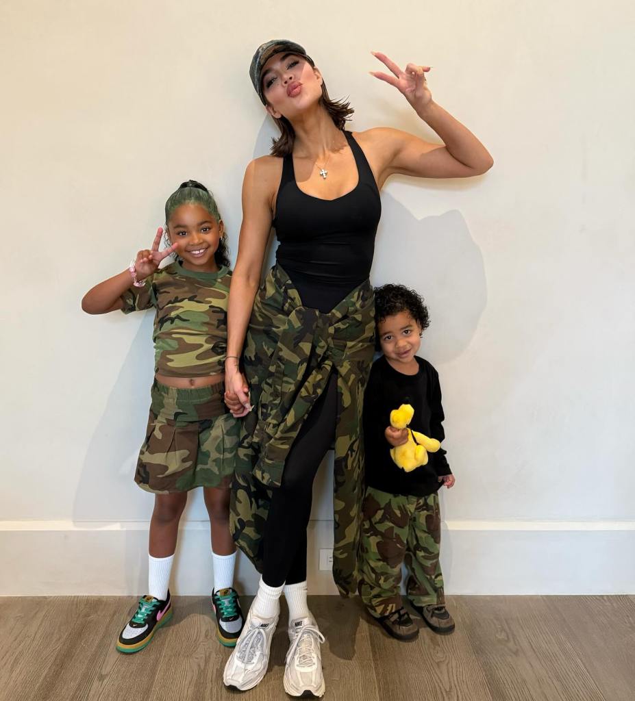 For kids True (left) and Tatum’s dress-up day at school, mom Khloé Kardashian gets in on the fatigues fun.