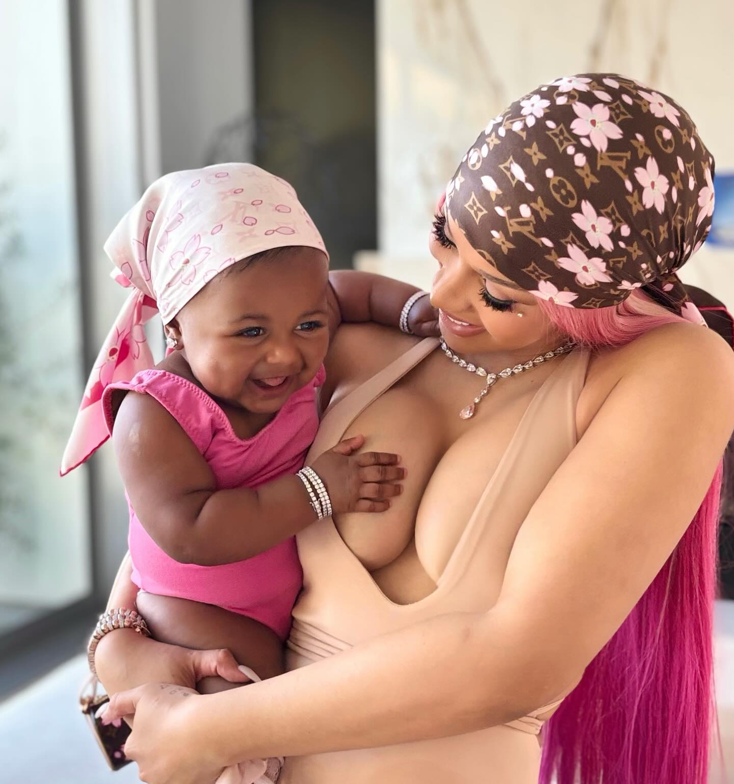 Blossom, 9 months, holds tight to mom Cardi B in the first look the rapper has shared of her youngest.
