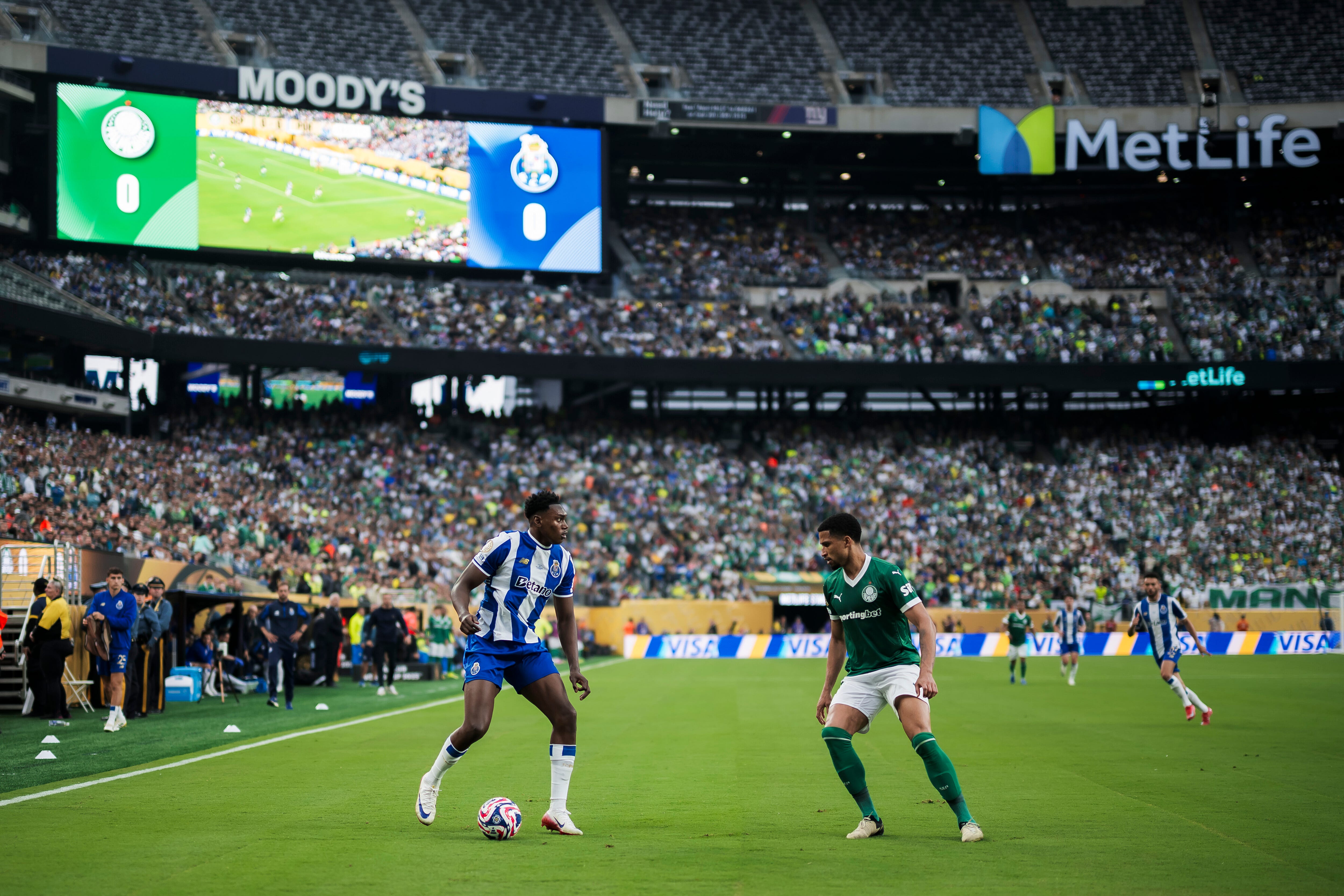 Samu Aghehowa (L) of FC Porto is challenge by Murilo Cerqueira of SE Palmeiras during the FIFA Club World Cup football match between SE Palmeiras and FC Porto. The match ended 0-0 tie. (