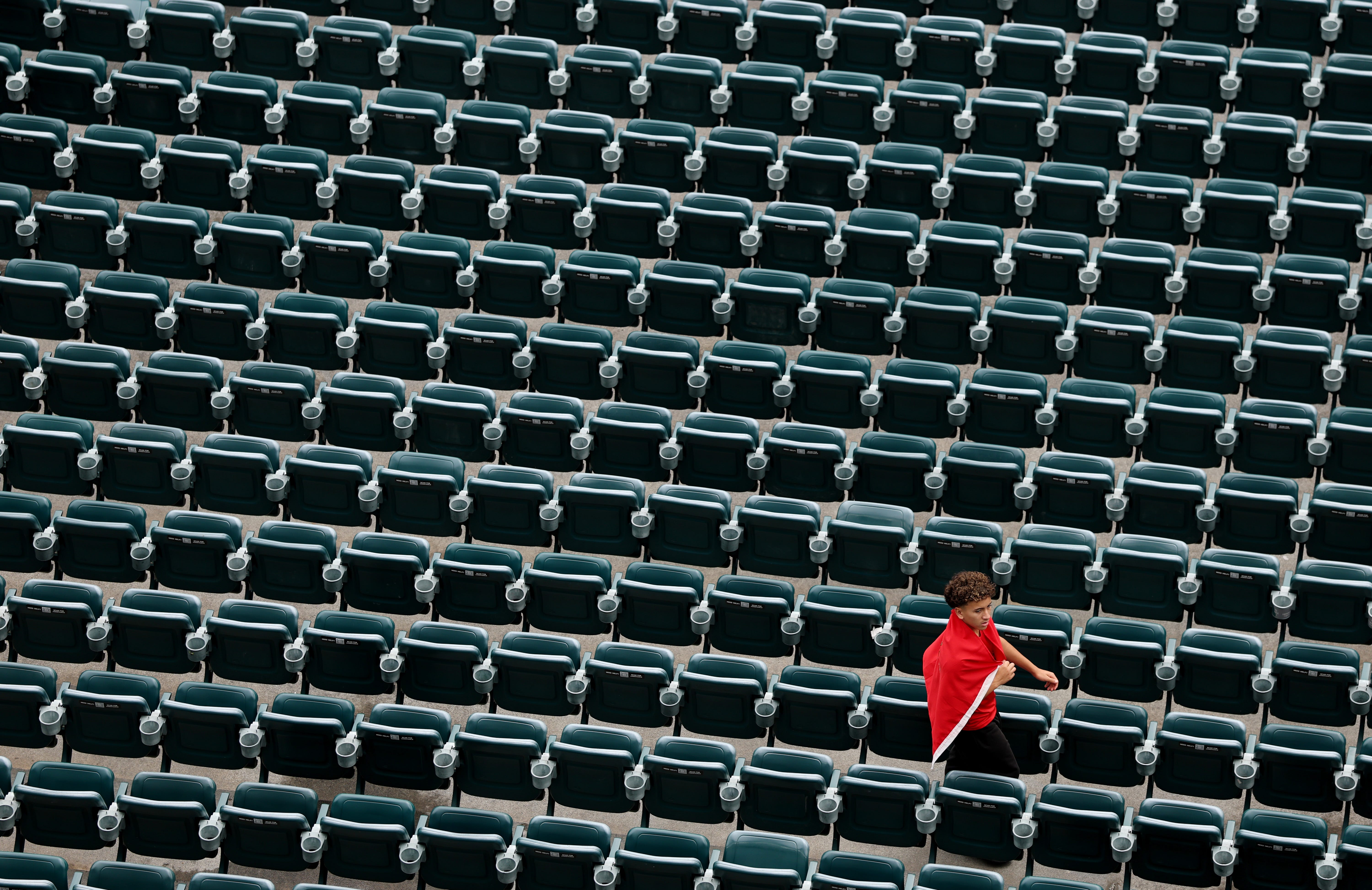 A fan supporting Wydad AC walks through the empty seats inside the stadium during the FIFA Club World Cup 2025 group G match between Manchester City FC and Wydad AC at Lincoln Financial Field on June 18, 2025 in Philadelphia, Pennsylvania.