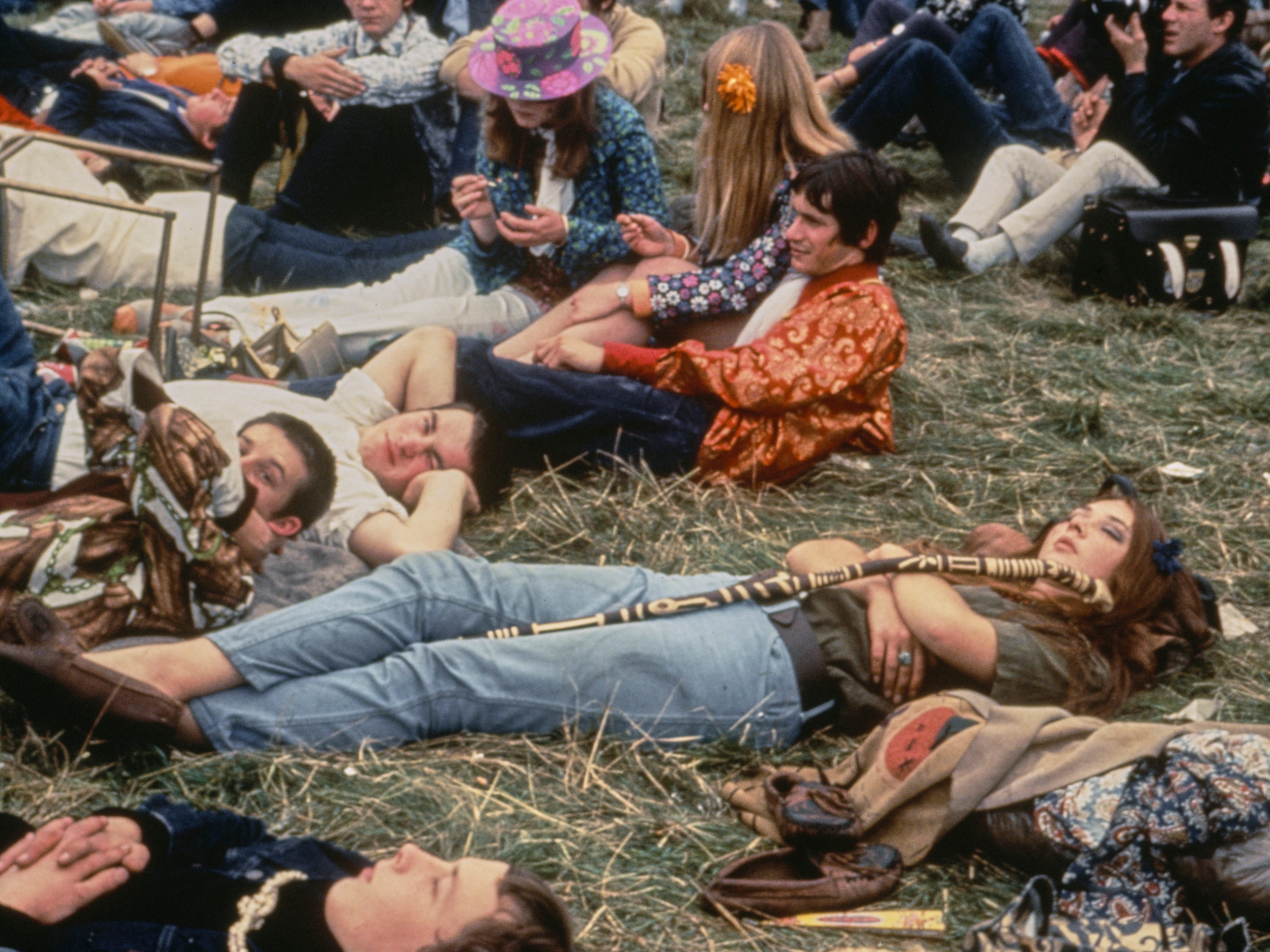 Young people relaxing on the grass at the 'Festival of the Flower Children' at Woburn Abbey in Bedfordshire, August 1967