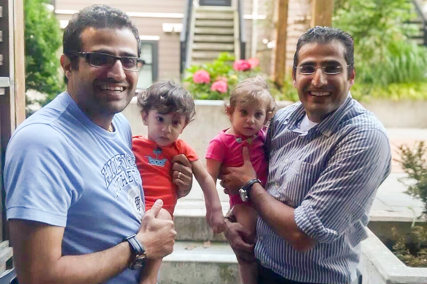 Twins holding baby twins