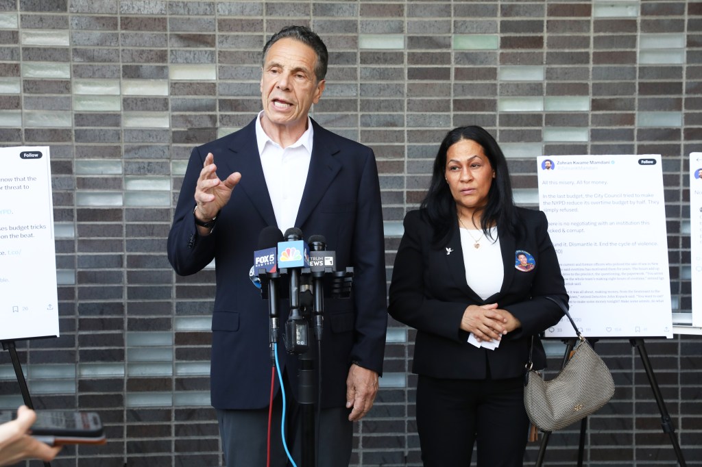 Andrew Cuomo and Leandra Feliz at a press conference.