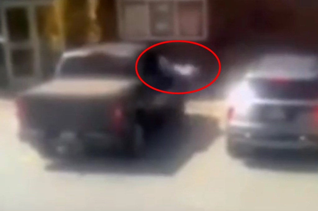 Blurry image of a robbery in progress.