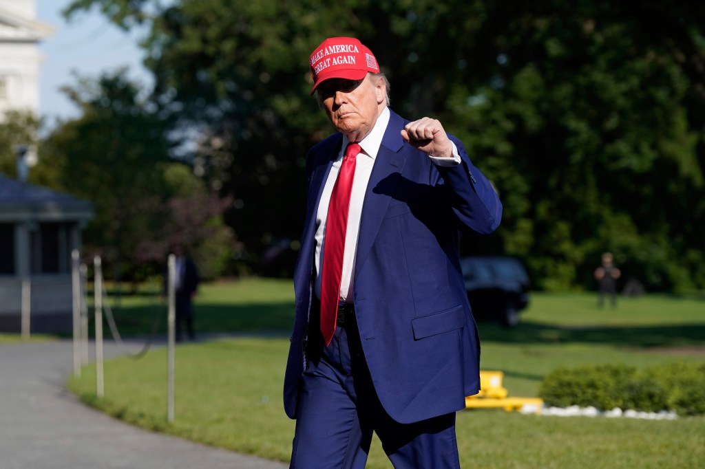 President Trump walking on the White House lawn.