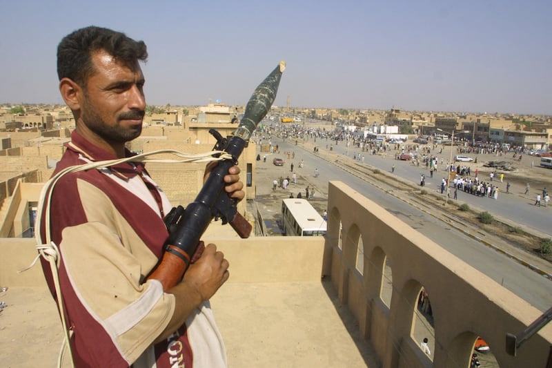 Armed militiaman loyal to anti-U.S. Shiite firebrand cleric Moqtada al-Sadr.