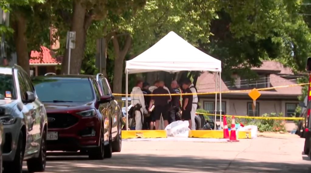 Law enforcement wearing hazmat suits stage outside VanDuyne's home.