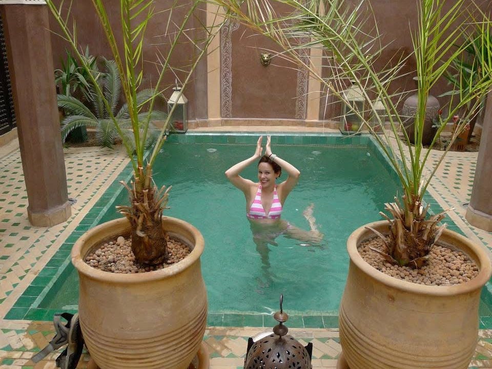 The author in a swimsuit in a pool in Morocco.