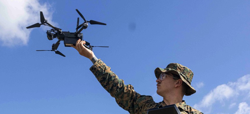 A U.S. Marine Corps corporal with the School of Infantry-West trains with a drone at MCB Camp Pendleton, Calif., on May 14, 2025. 