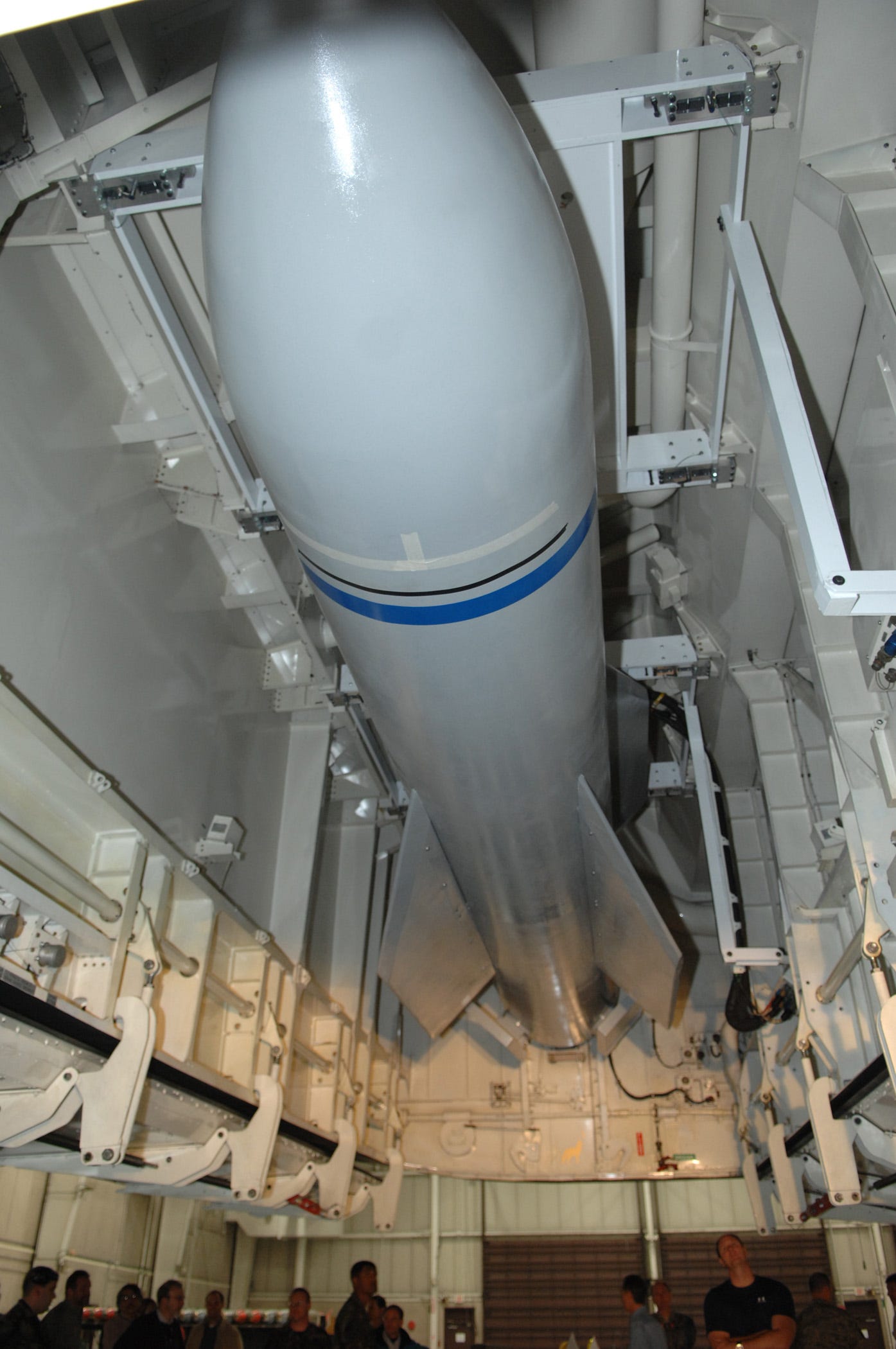A mock-up of the Massive Ordnance Penetrator sits in the bomb bay of the B-2 weapons load trainer.