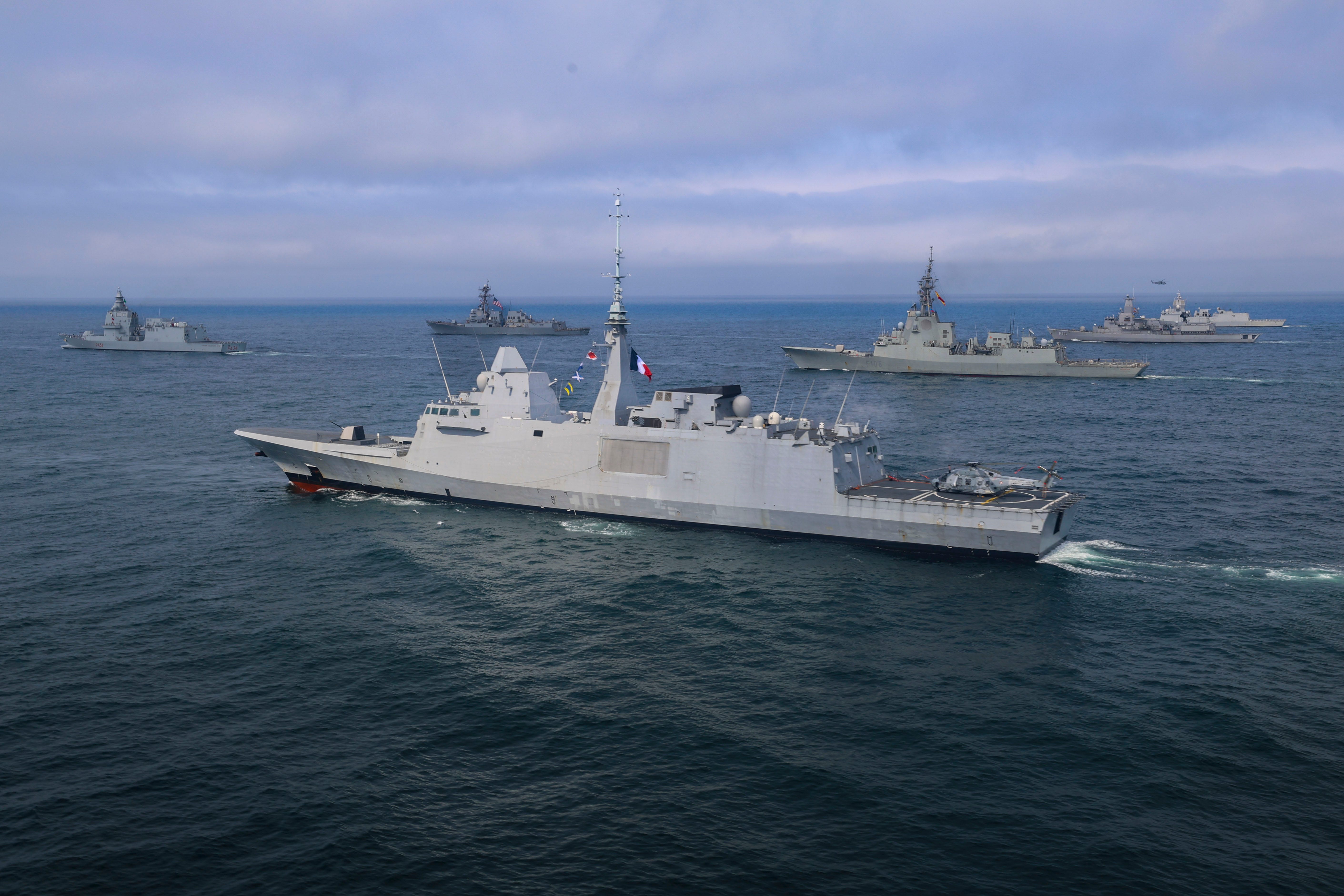 The French Navy Aquitaine-Class frigate FS Normandie, center, participates in a PHOTOEX during At-Sea Demonstration (ASD) / Formidable Shield (FS) 2025.