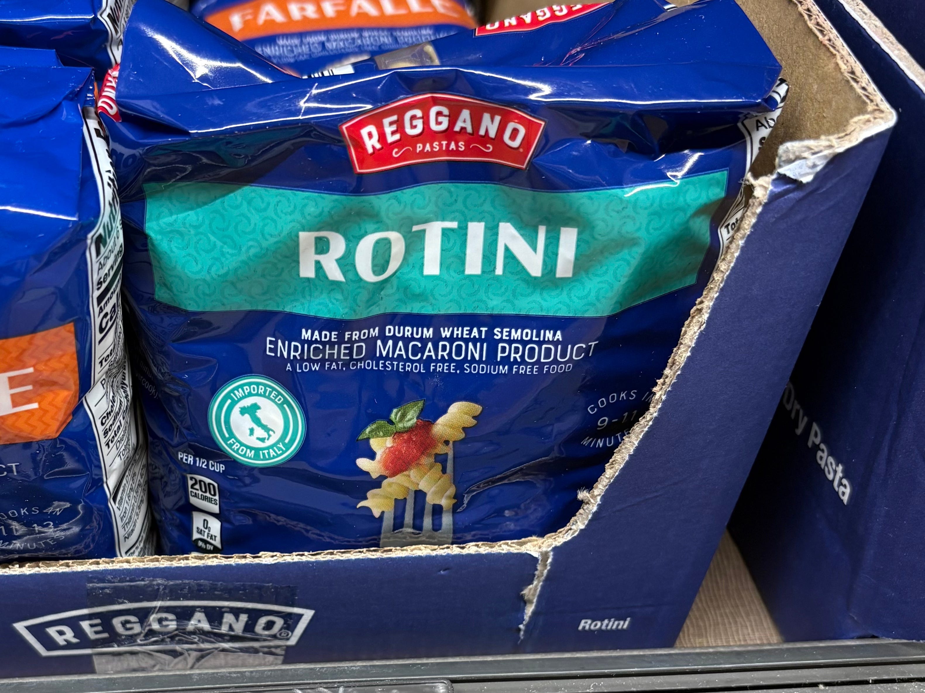 Bags of Reggano Pastas rotini and farfalle noodles.