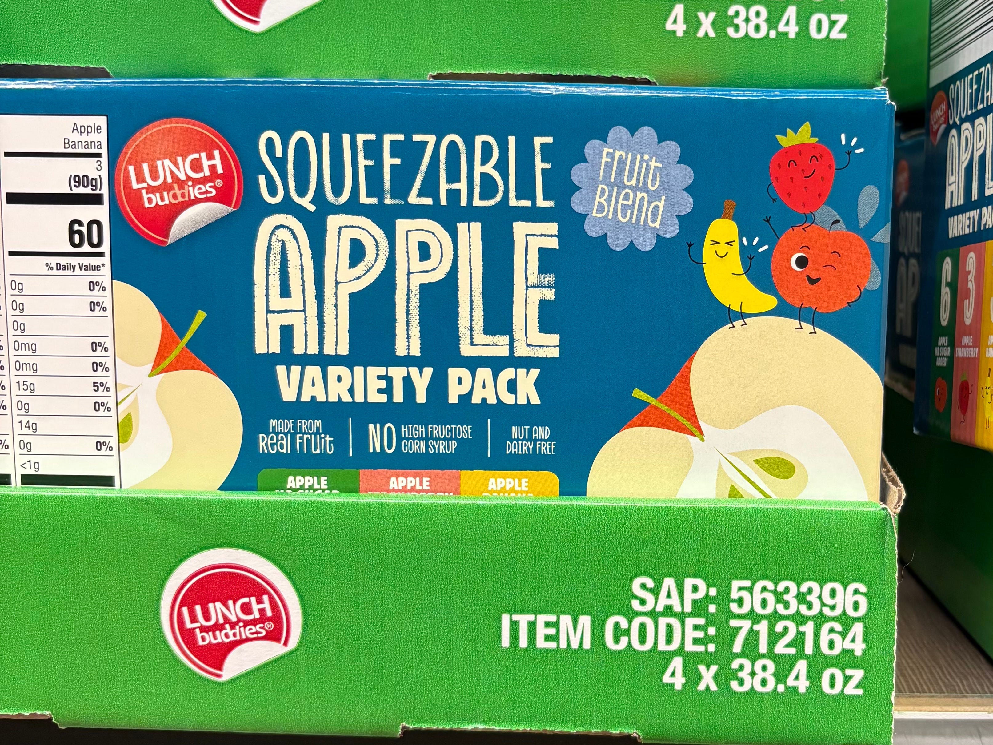 A display box of Lunch Buddies squeezable apple variety pack.