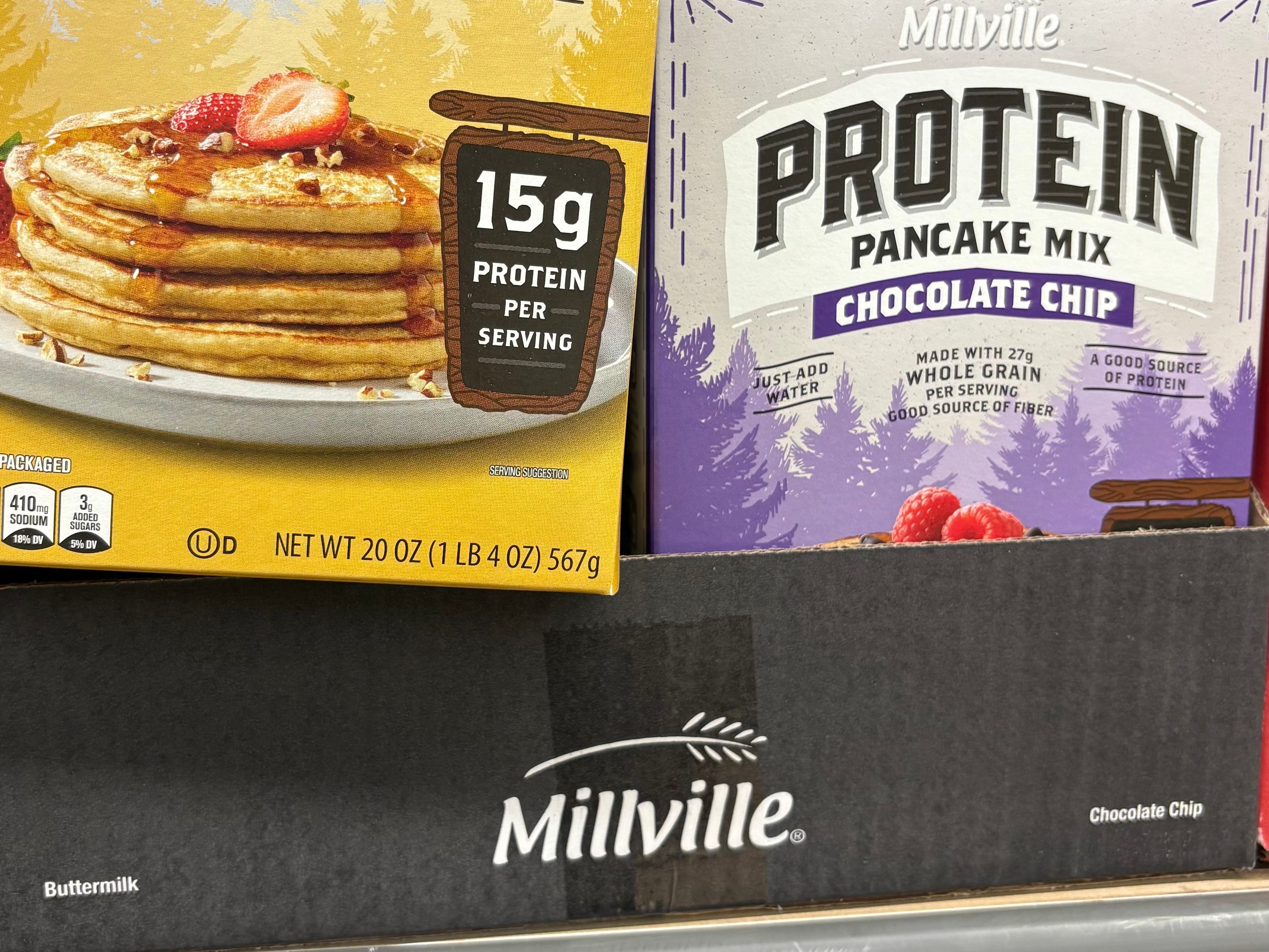 A display of Millville protein pancake mix and Millville chocolate chip protein pancake mix.