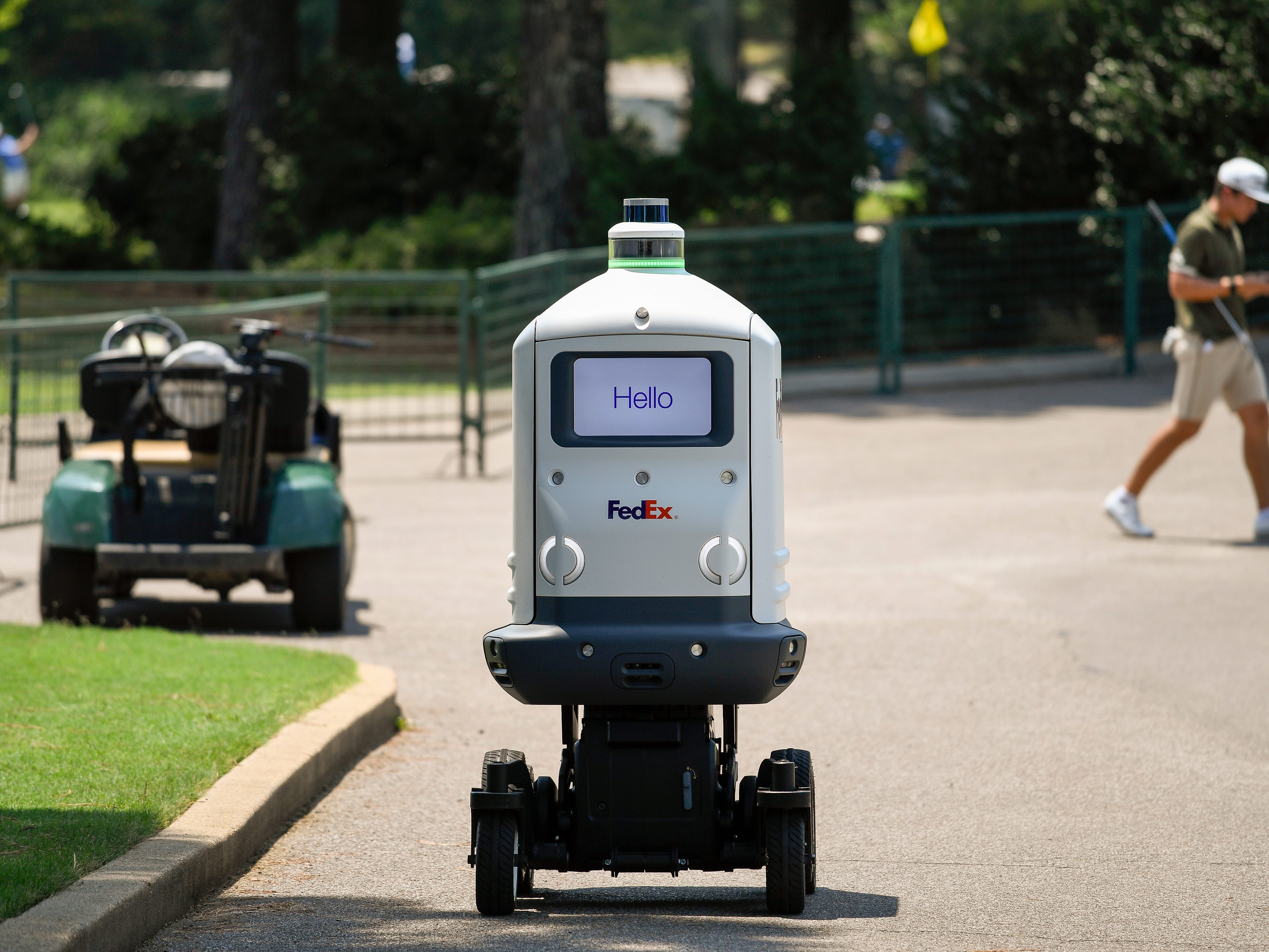 FedEx's delivery robot Roxo makes a delivery at the PGA Tour in 2021.