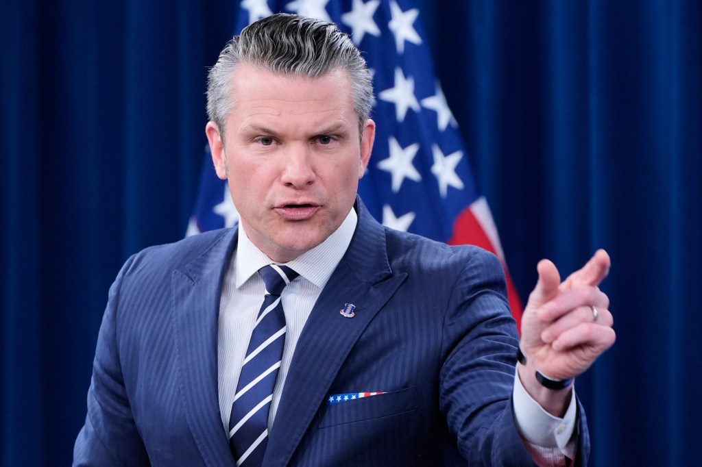 Pete Hegseth speaking at a press conference.