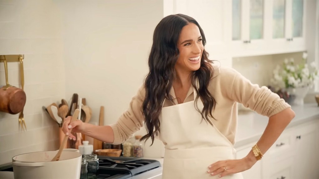 Meghan Markle cooking in a Meringue Le Creuset pot.