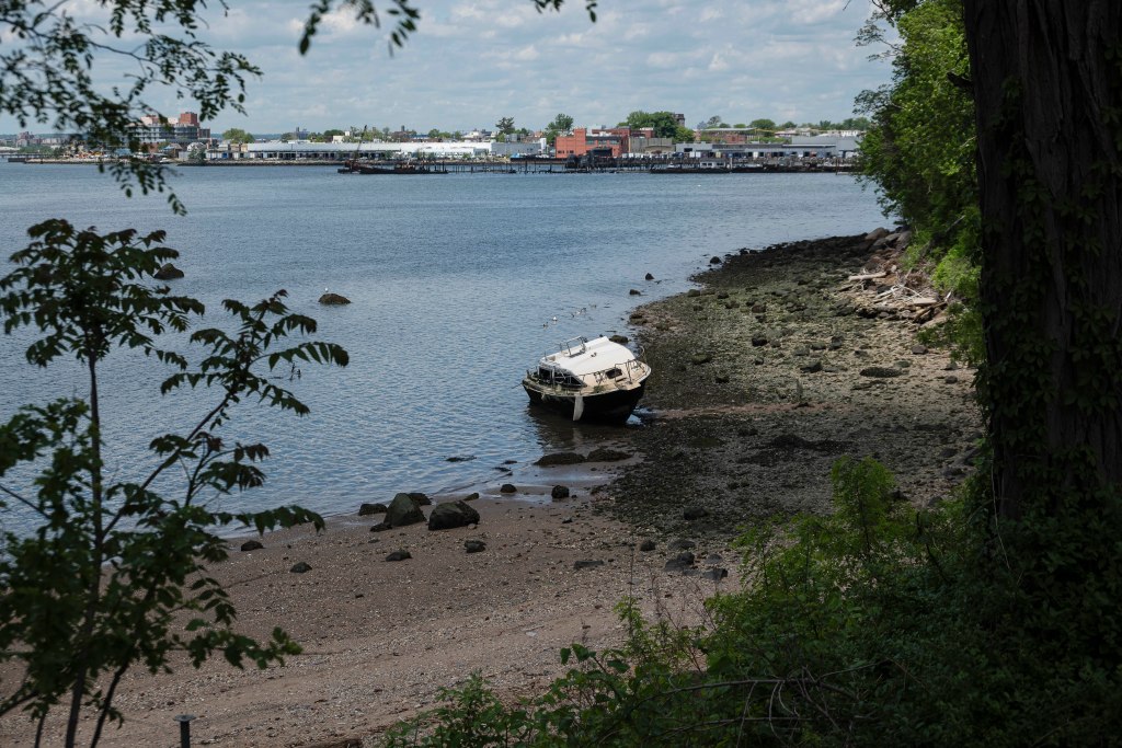 An abandoned boat on the shore of Big Rock Beach. 