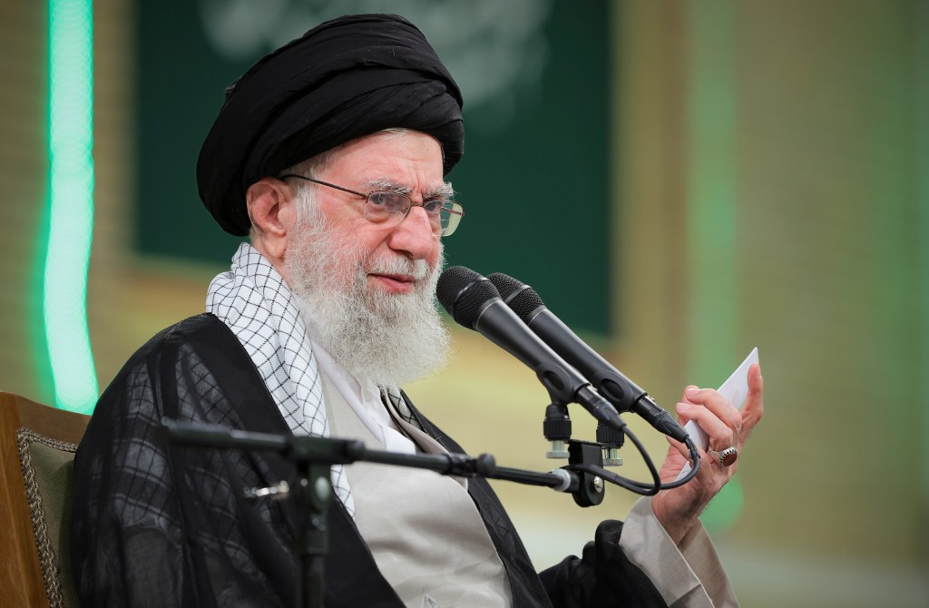 Ayatollah Ali Khamenei speaking at a meeting.