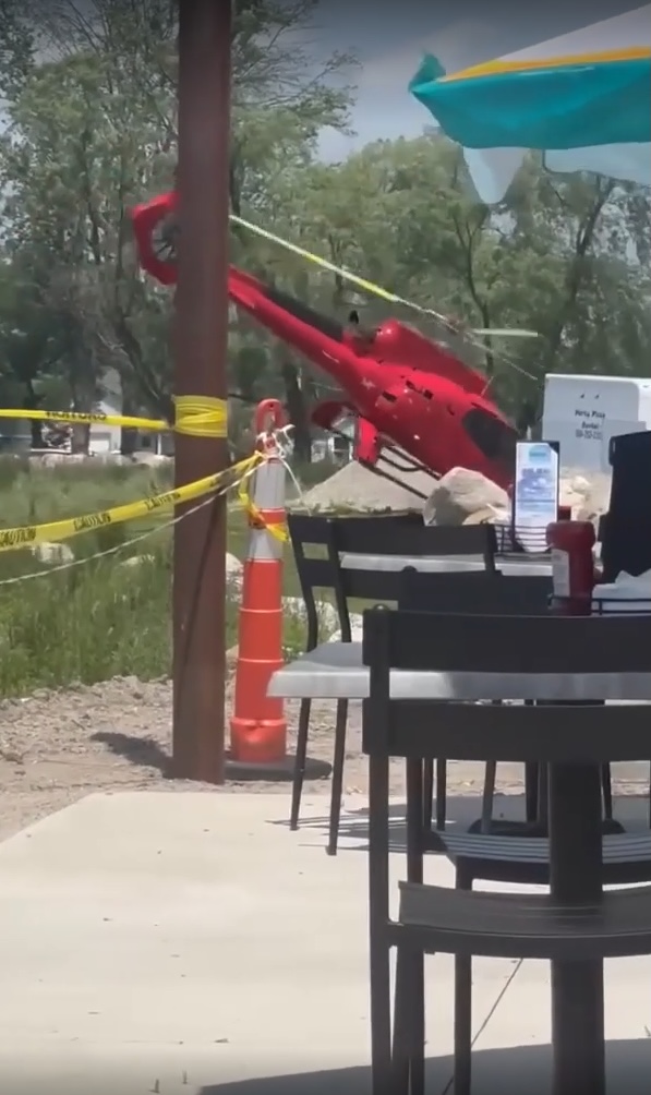 Helicopter crashed near a lake.