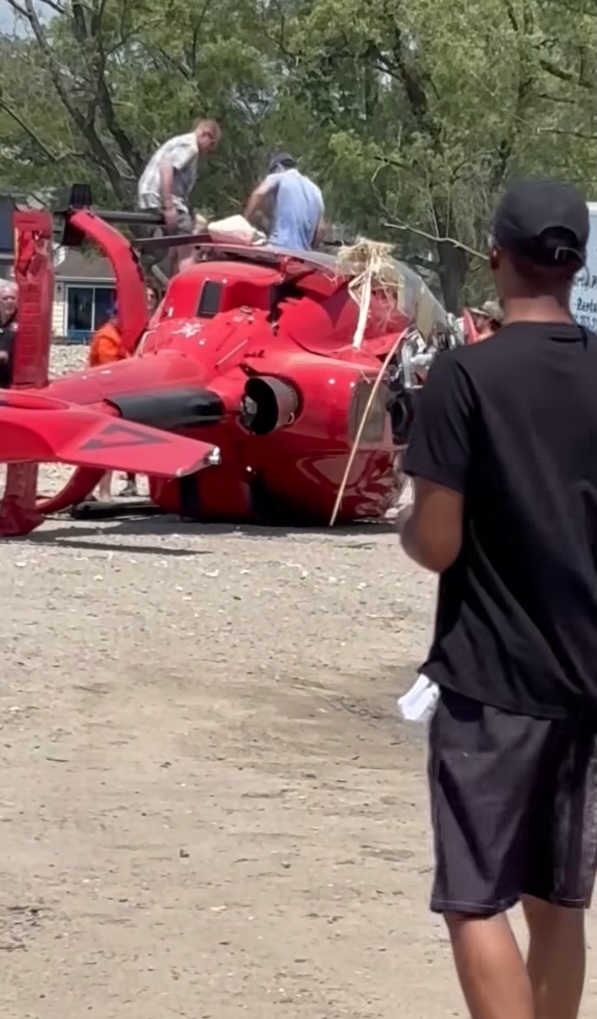 Helicopter crash near a lake.