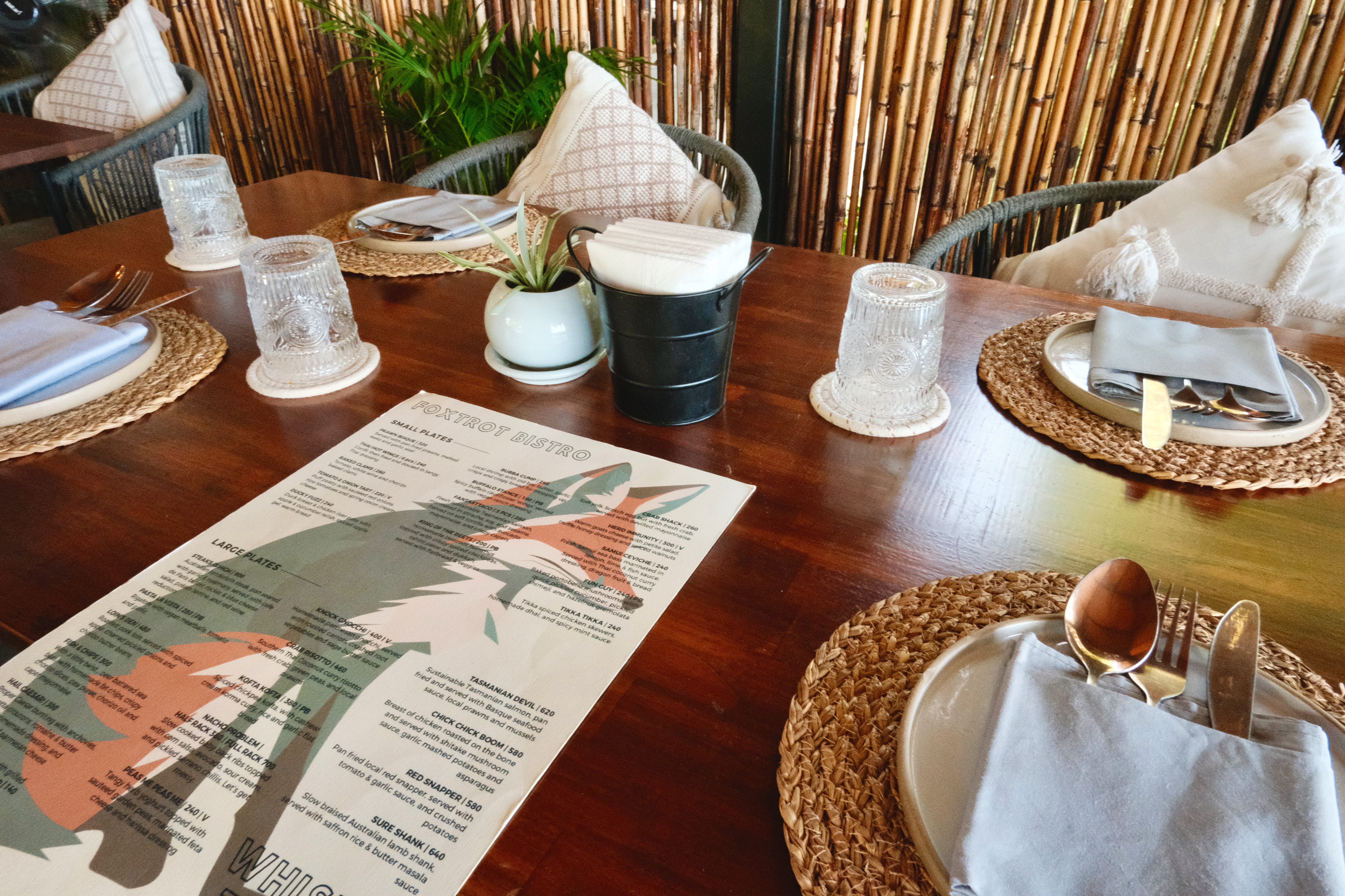 A close up of the menu and the table setting at Foxtrot Bistro in Koh Samui, Thailand.