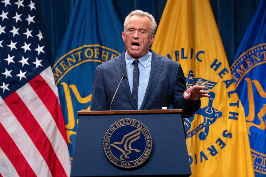 Robert F. Kennedy Jr. speaking at a podium.